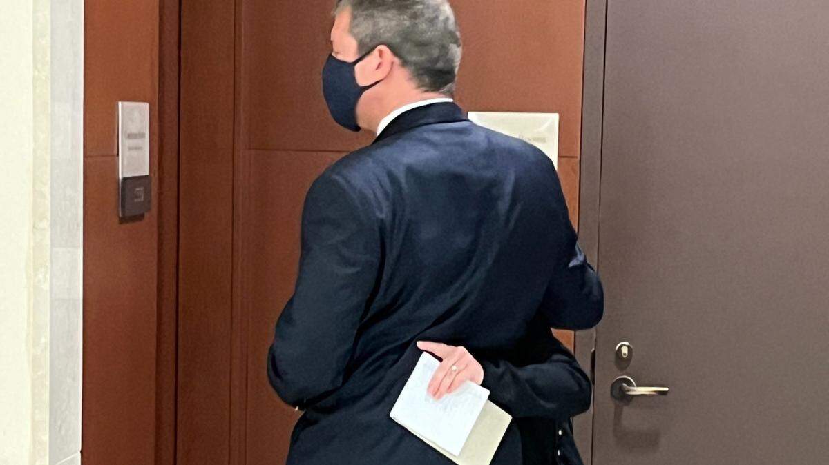 Evan Roy Wilkoff, a former president of Temple Beth El, hugs his wife inside the Mecklenburg County courthouse on Monday after pleading guilty to a child pornography charge.