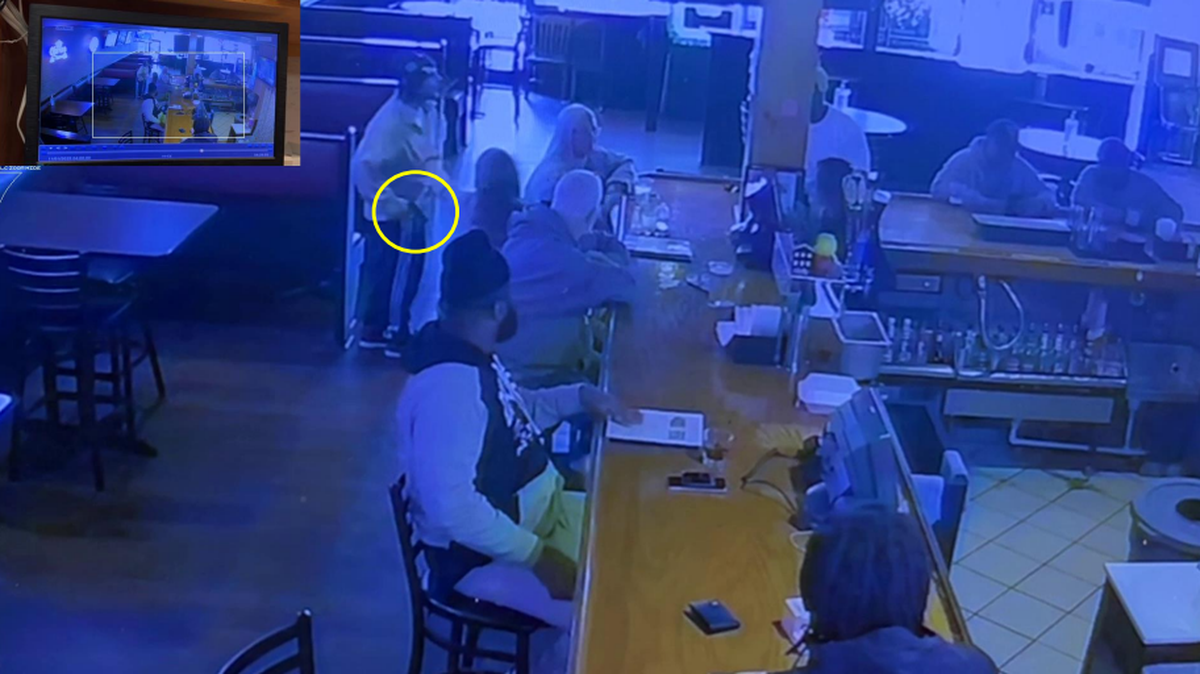 Colton Maxwell Floren brandishing a gun inside Tavern 51.
