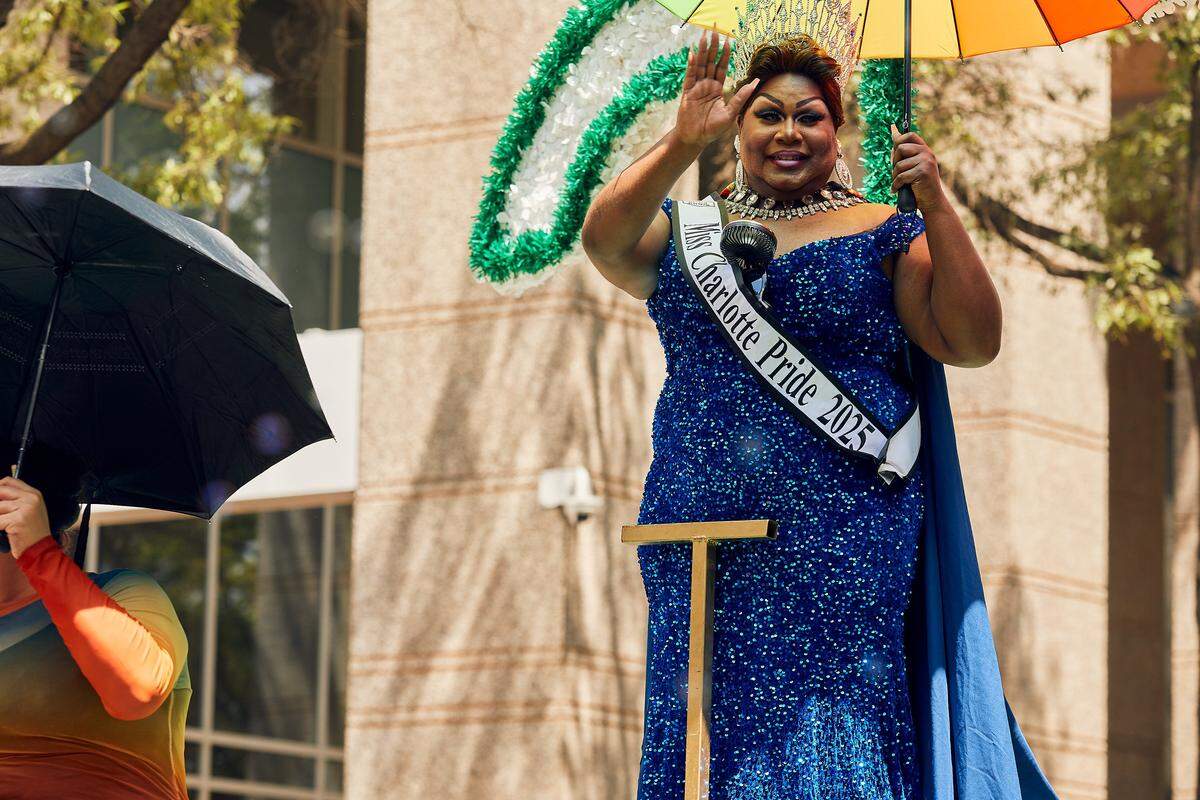 Ms. Charlotte Pride 2025 waves to the crowd during the 25th Charlotte Pride Parade in uptown Charlotte on August 17, 2025.