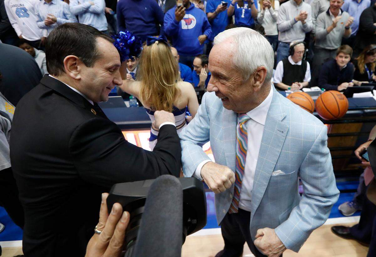 This year’s Duke-UNC basketball rivalry is without Roy Williams, right, who retired after last season. Next year, Mike Krzyzewski won’t be on the Blue Devils’ bench. He announced in November that this would be his final season.