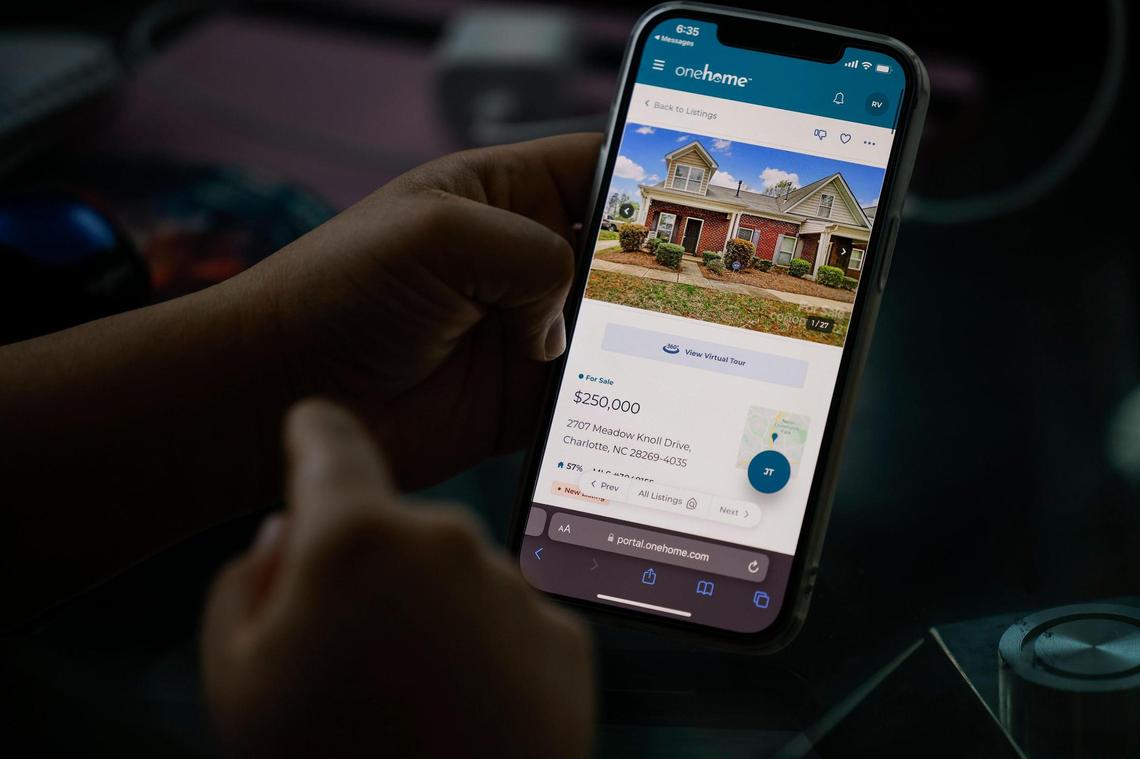 Rochelle Vassar shows a saved home listing on her phone.