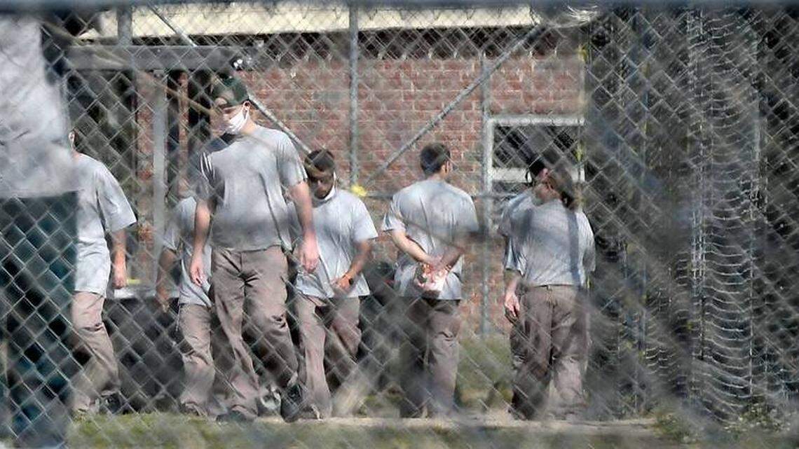 Inmates at Neuse Correctional Institution, in Goldsboro, move between buildings.