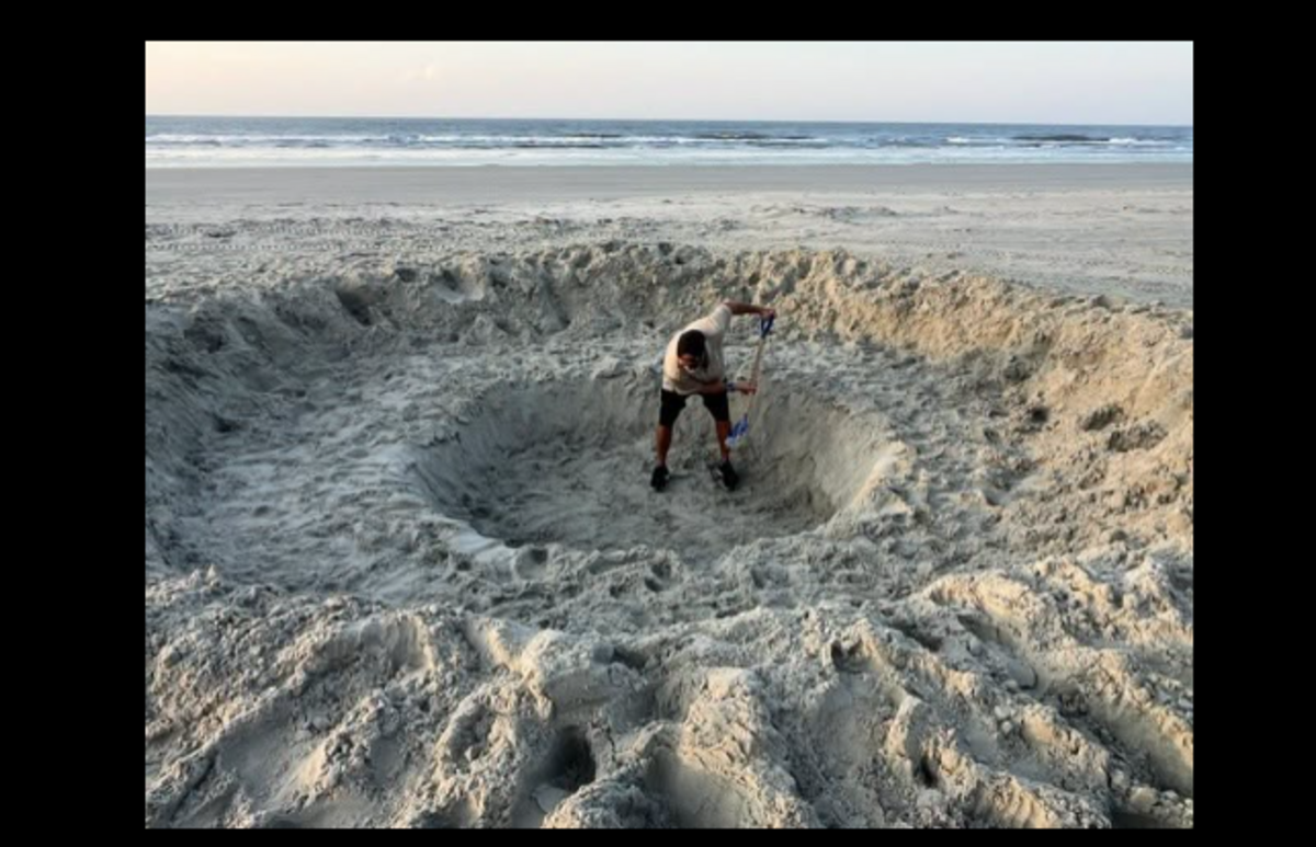 A Sunset Beach worker attempted to fill in the massive hole with a shovel, but town officials eventually called in a backhoe, police say.