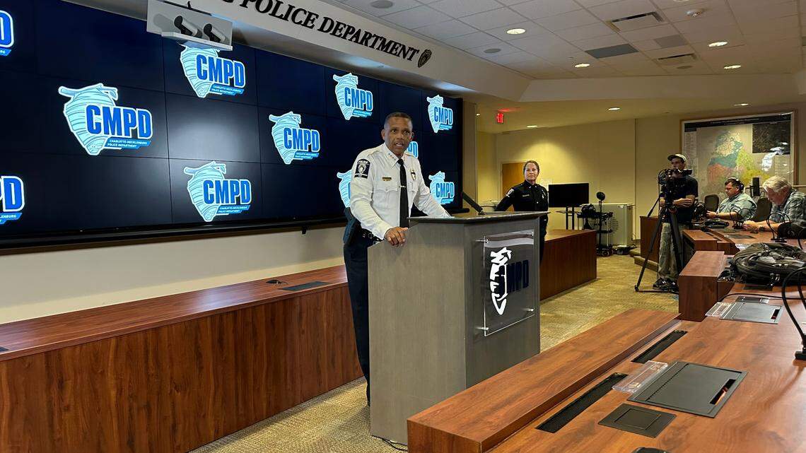Chief Johnny Jennings of the Charlotte-Mecklenburg Police Department briefs the media on Thursday, July 11, 2024, on arrests in a series of shootings. Jennings spoke at CMPD headquarters in uptown. At right is Lt. Crystal Fletcher, who oversees department public affairs.