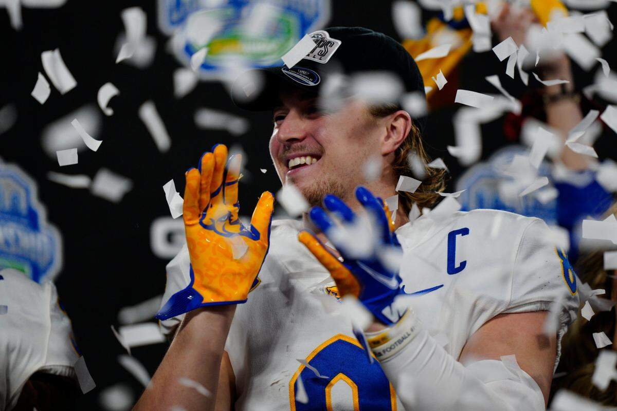 Pittsburgh quarterback Kenny Pickett celebrates after his team’s 45-21 win against Wake Forest in the Atlantic Coast Conference championship NCAA college football game Sunday, Dec. 5, 2021, in Charlotte, N.C. Pickett, the ACC Player of the Year, accounted for three touchdowns.