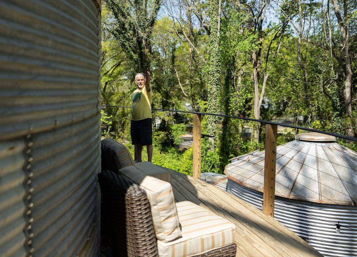 Tom Flohr stands on the balcony while he gives a tour of the silo he converted into an short term rental property in Lincolnton, N.C., on Friday, April 3, 2026.