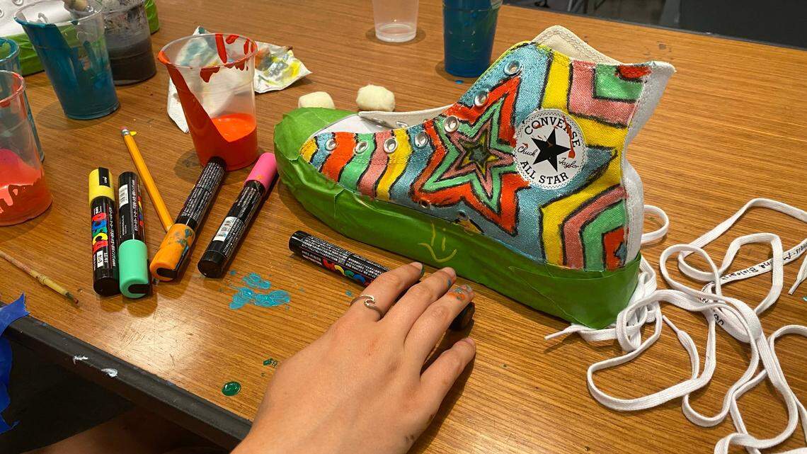 One girl decided to paint her Converse Chuck Taylors with a starry pattern emanating from the center of the shoe.