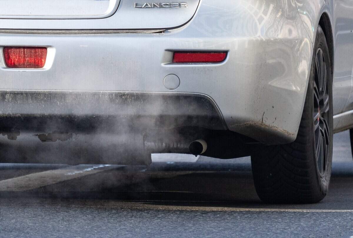 An exhaust pipe of a car with a combustible engine expels fumes. Whether Mecklenburg County would continue emissions testing is dependent on the EPA ruling.