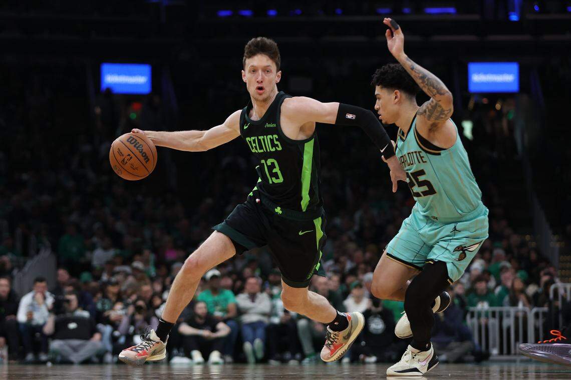 Boston Celtics forward Drew Peterson (13) dribbles down the court during the first half against the Charlotte Hornets at TD Garden.