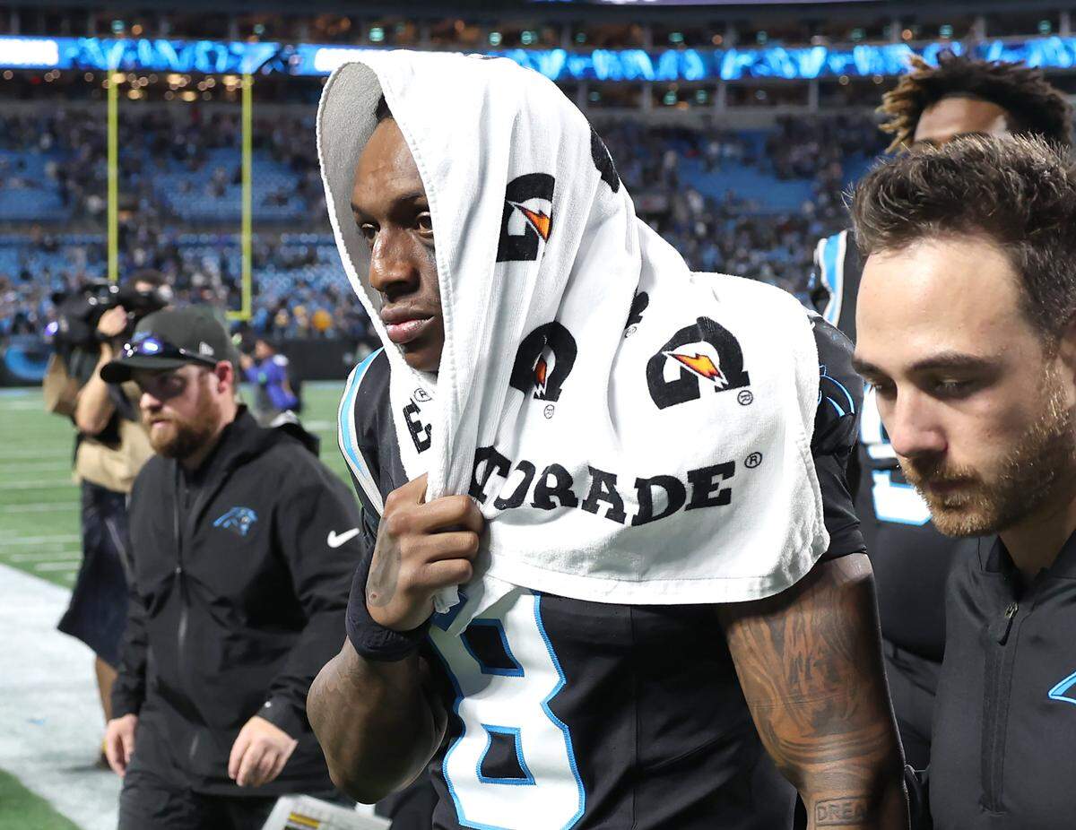 Carolina Panthers cornerback Jaycee Horn walks off the field dejectedly following the team’s 34-31 loss to the Los Angeles Rams in the NFL playoffs on Saturday at Bank of America Stadium. Horn wasn’t able to play on the game’s final drive due to injury.