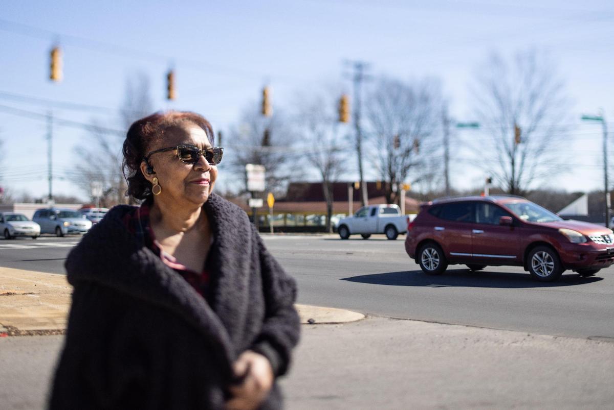 Marjorie Parker poses for a portrait in front of North Tryon Street in Charlotte, N.C., on Monday, February 6, 2023.