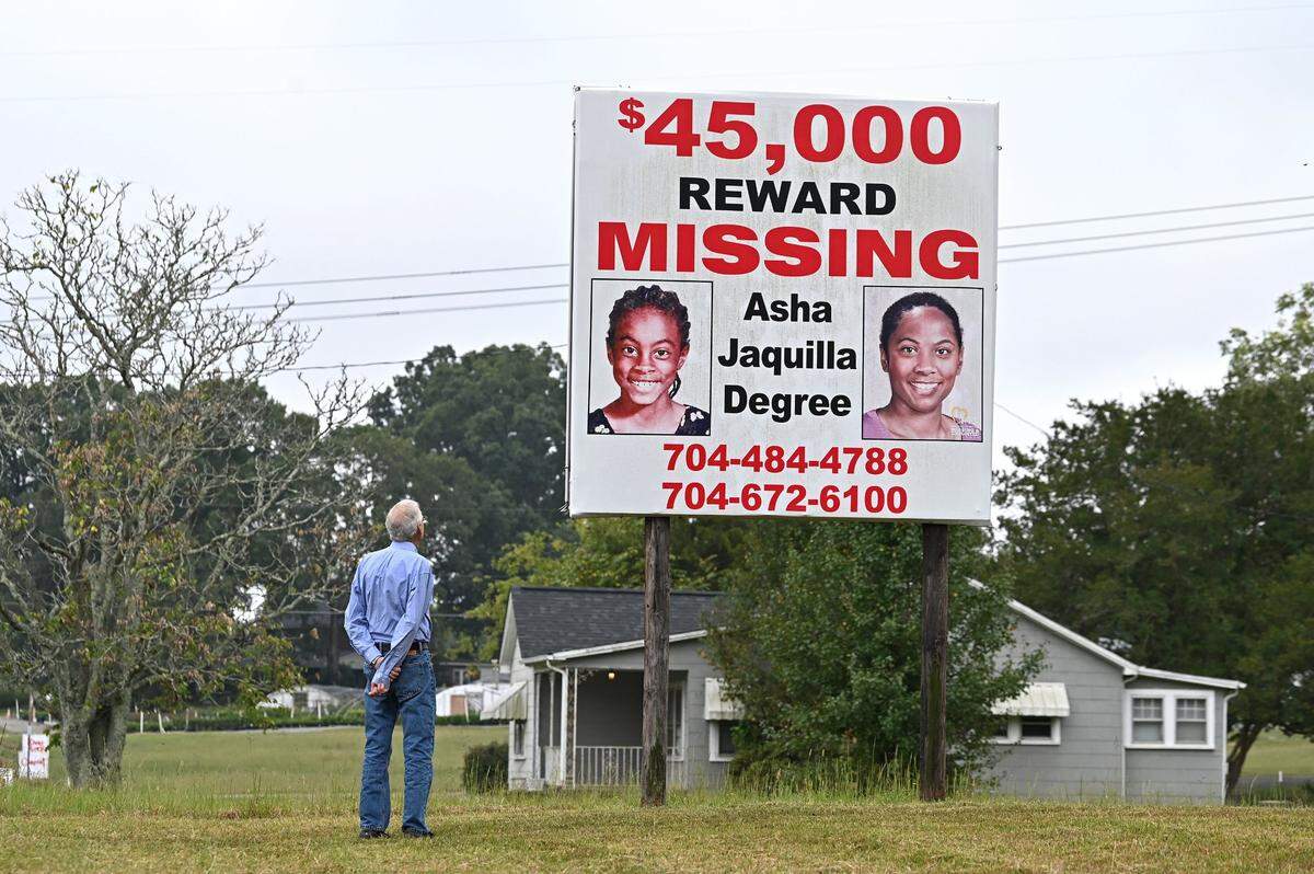 Rick Dancy looks at the sign showing Asha Degree when she was 9 years old and what she potentially could look like 24-years later on Monday, Sept. 23, 2024. Dancy was the Red Cross executive director in Shelby, N.C., in 2000 when Asha Degree went missing. Dancy and his team helped establish a command center where searchers could gather at a nearby church.