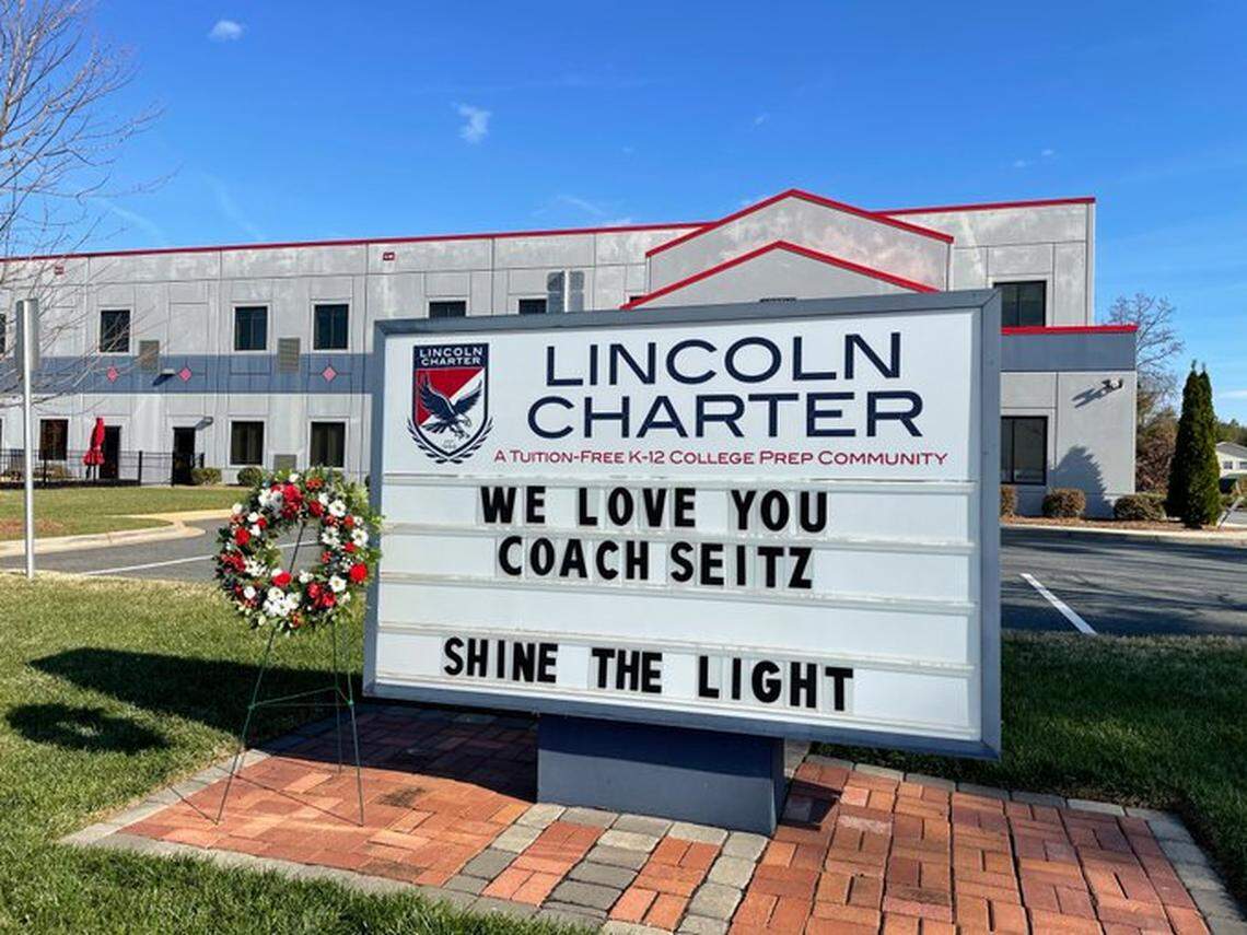 A school sign at Lincoln Charter Elementary in Denver, N.C., honors teacher and coach Jamie Seitz, who died from COVID-19 on Dec. 27, 2020. He was 51.