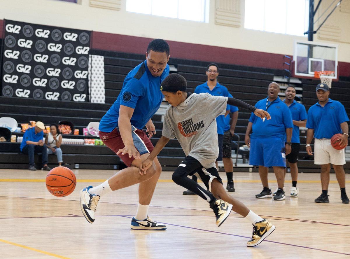 Dallas Mavericks Grant Williams and former Providence Day basketball player plays kids one on one at his basketball camp at West Charlotte High School in Charlotte, N.C., on Friday, July 21, 2023.