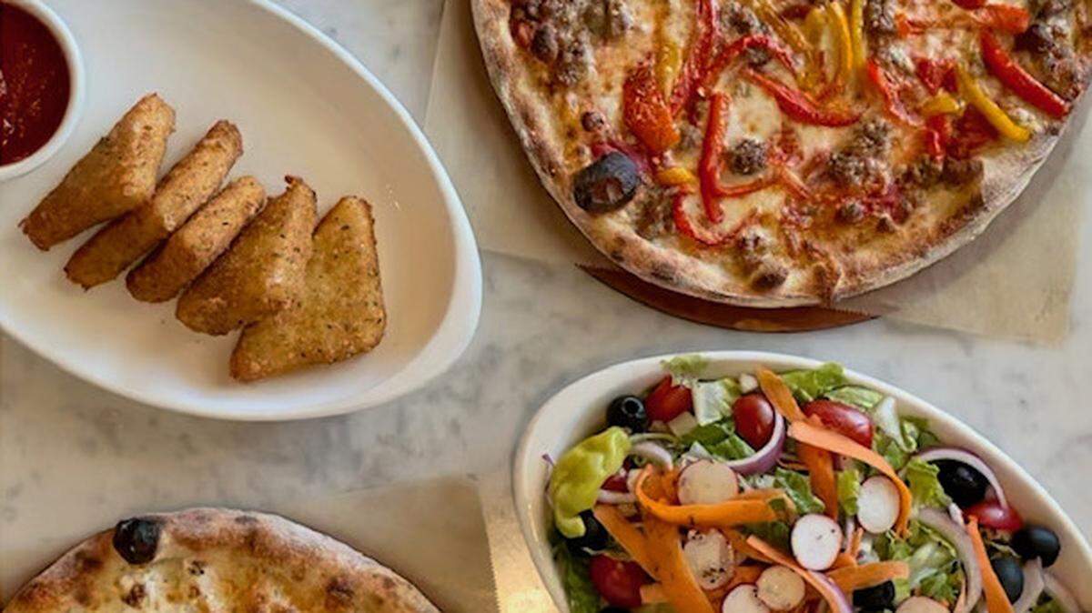 True Crafted Pizza serves oven-baked and grilled pizzas, salads, appetizers and more.