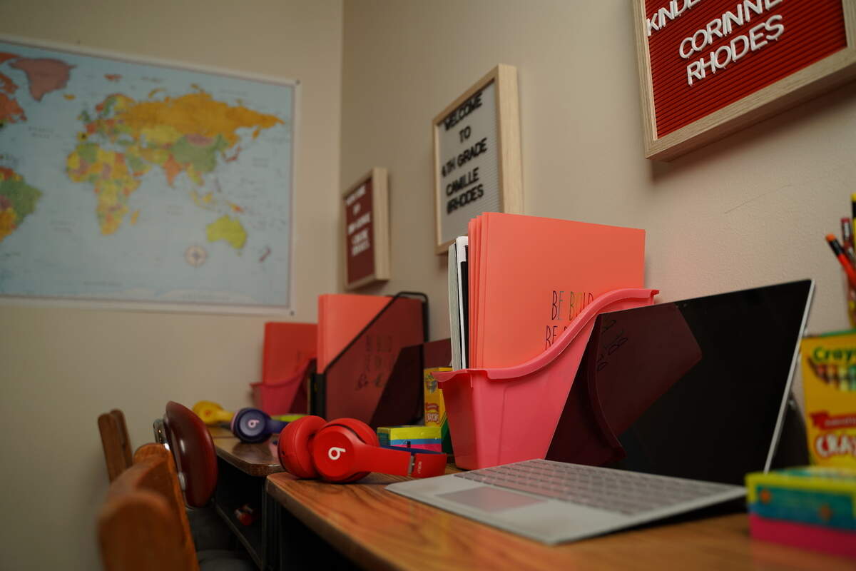 The Rhodes family set up a home classroom space to help their children dive in to virtual learning.