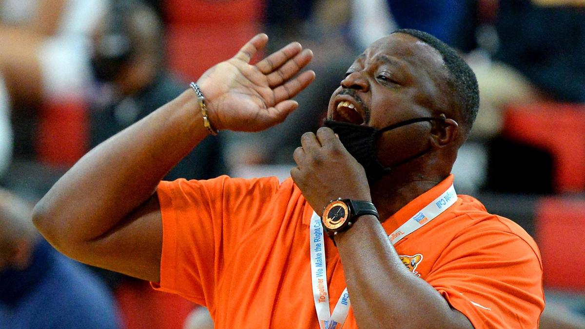 Vance Cougars head coach Donnell Rhyne yells instructions to his team during second half action of the 4A State Championship against Garner at Wheatmore High School in Trinity, NC on Saturday, March 6, 2021. Vance defeated Garner 74-38.
