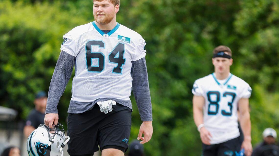 Carolina Panthers offensive lineman Cade Mays (64) walks to the field during rookie minicamp at the Panthers practice field in Charlotte, N.C., Friday, May 13, 2022.