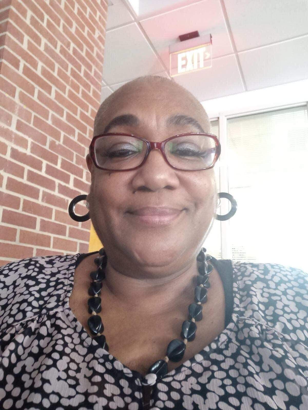 Stephanie Bottom, pictured here, said the injuries she suffered to her left arm during a 2019 traffic stop have made it difficult to style her hair. As a result, she said, she has shaved her hair and now wears wigs.