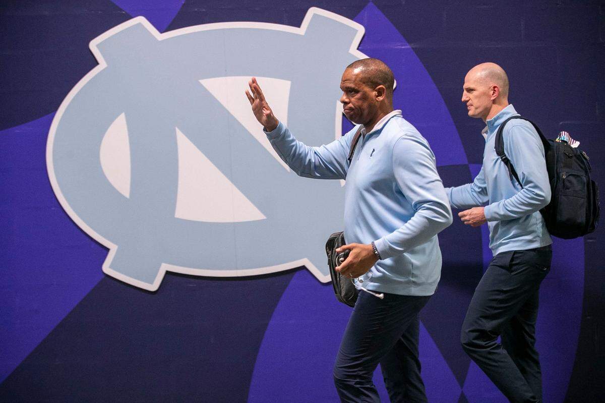 North Carolina coach Hubert Davis and assistant coach Brad Frederick arrive for their NCAA National Championship game against Kansas on Monday, April 4, 2022 at Caesars Superdome in New Orleans, La.