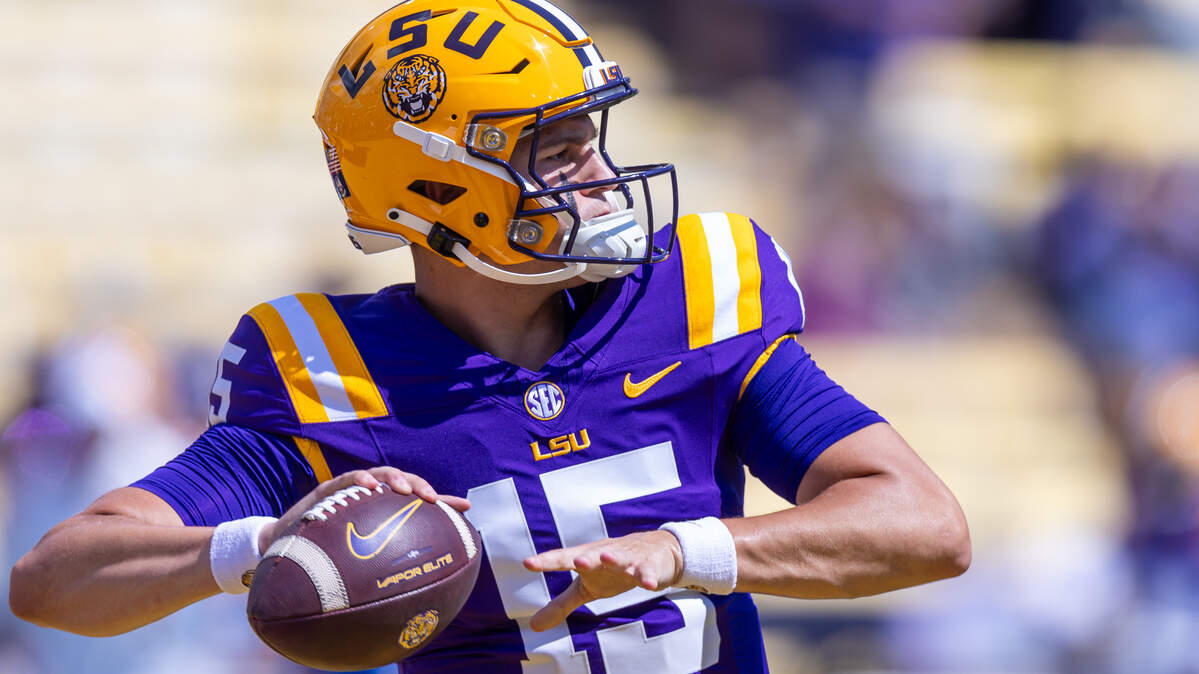 Sep 21, 2024; Baton Rouge, Louisiana, USA;  LSU Tigers quarterback AJ Swann (15) during warmups before a game against the UCLA Bruins at Tiger Stadium. Mandatory Credit: Stephen Lew-Imagn Images