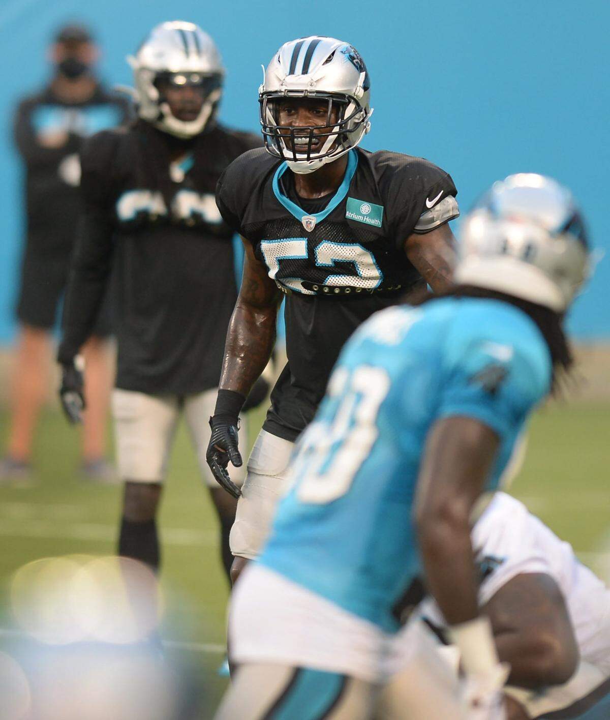 Carolina Panthers linebacker Tahir Whitehead smiles as he looks across the offensive line during practice at Bank of America Stadium on Wednesday, August 26, 2020.
