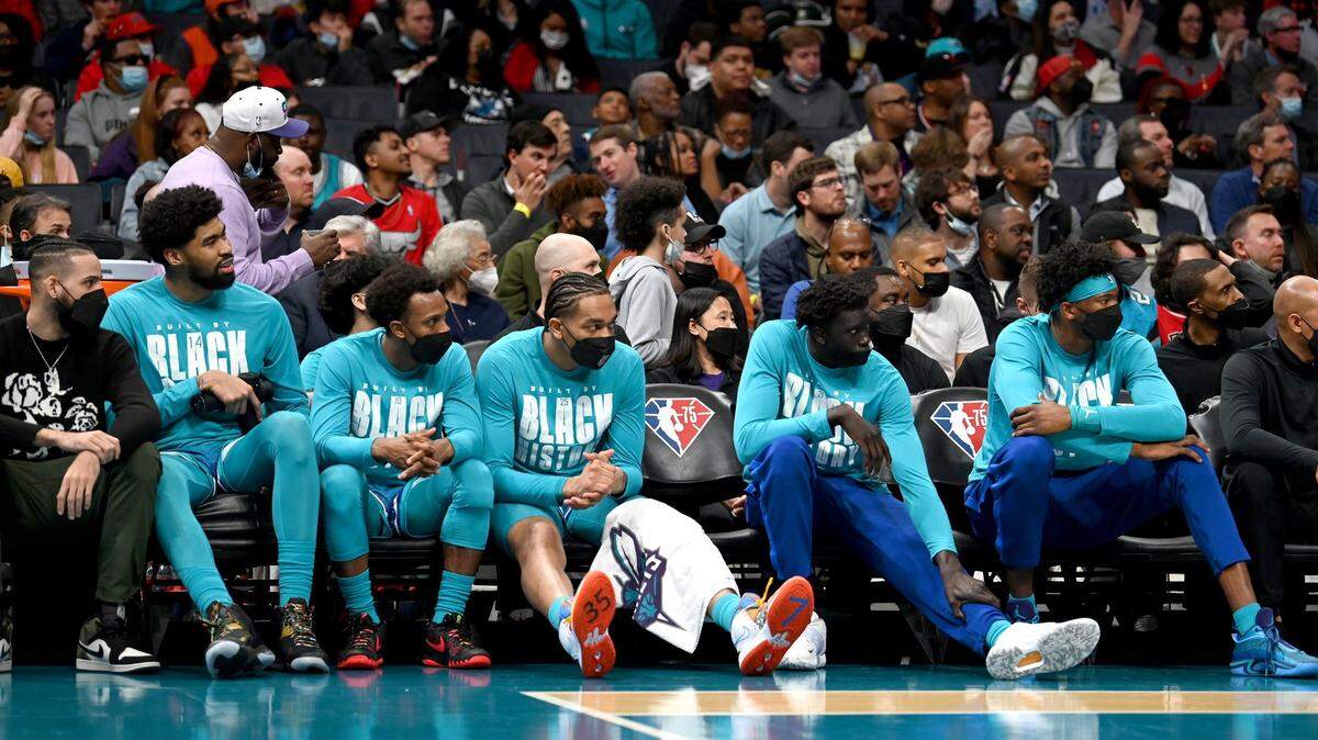 (L-R) Charlotte Hornets Cody Martin, Nick Richards, Ish Smith, PJ Washington, JT Thor and Kai Jones sit on the team’s bench during action against the Chicago Bulls at Spectrum Center in Charlotte on Wednesday. The Bulls defeated the Hornets 121-109.