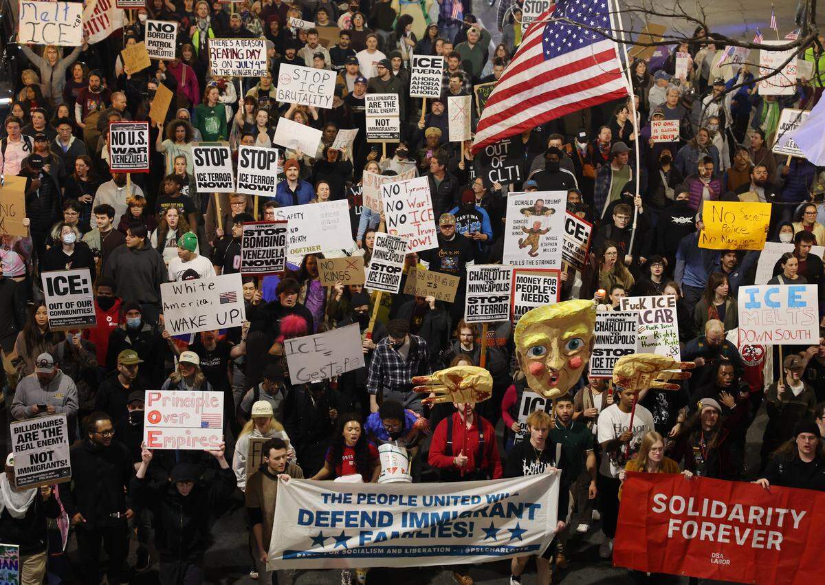 Protesters march in uptown Charlotte Thursday, Jan. 8, 2026 to protest ICE after an agent shot a woman in Minneapolis.