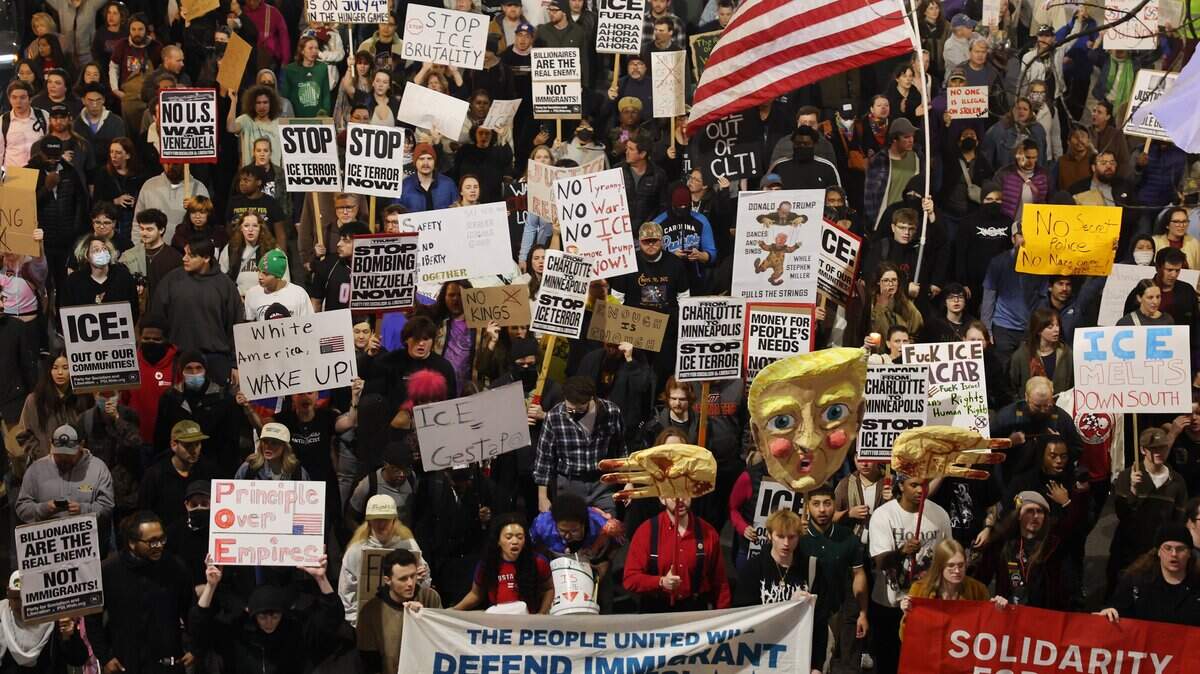 Protesters march in uptown Charlotte Thursday, Jan. 8, 2026 to protest ICE after an agent shot a woman in Minneapolis.