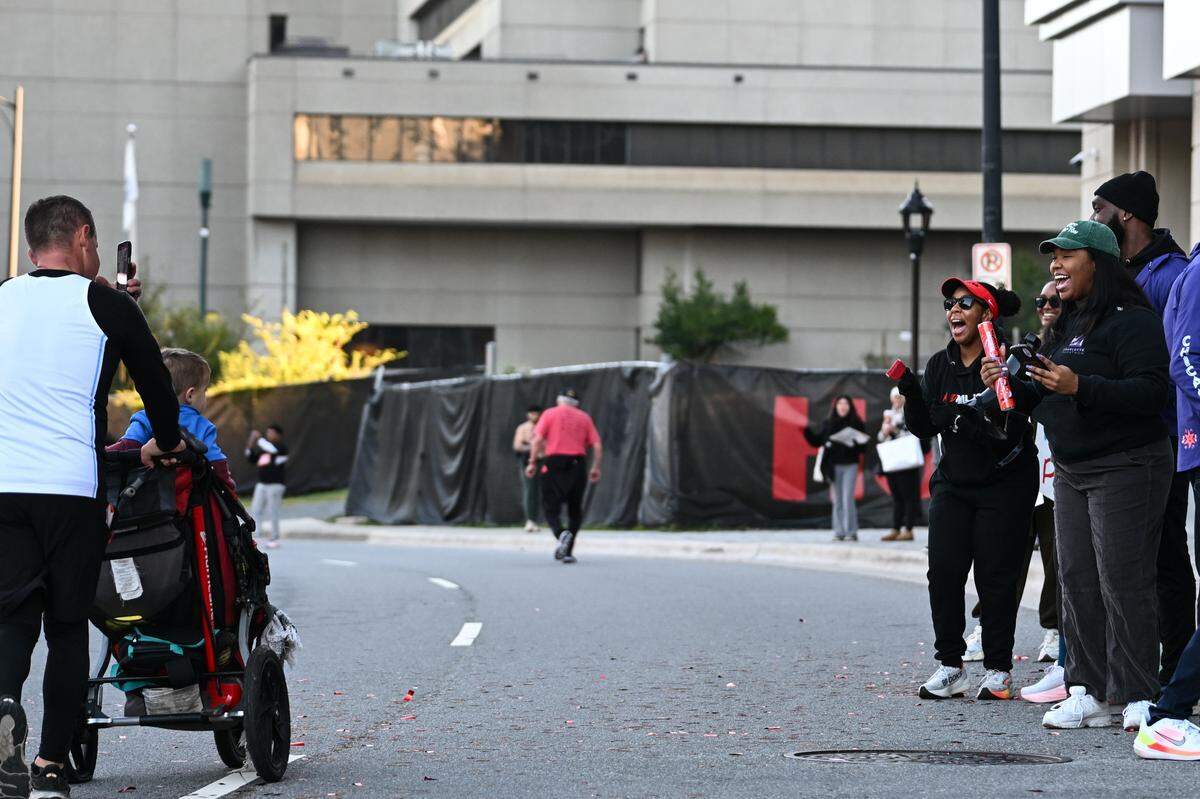Supporters cheer as participants take part in the 20th annual Novant Health Charlotte Marathon on Saturday, Nov. 16, 2024, in Charlotte