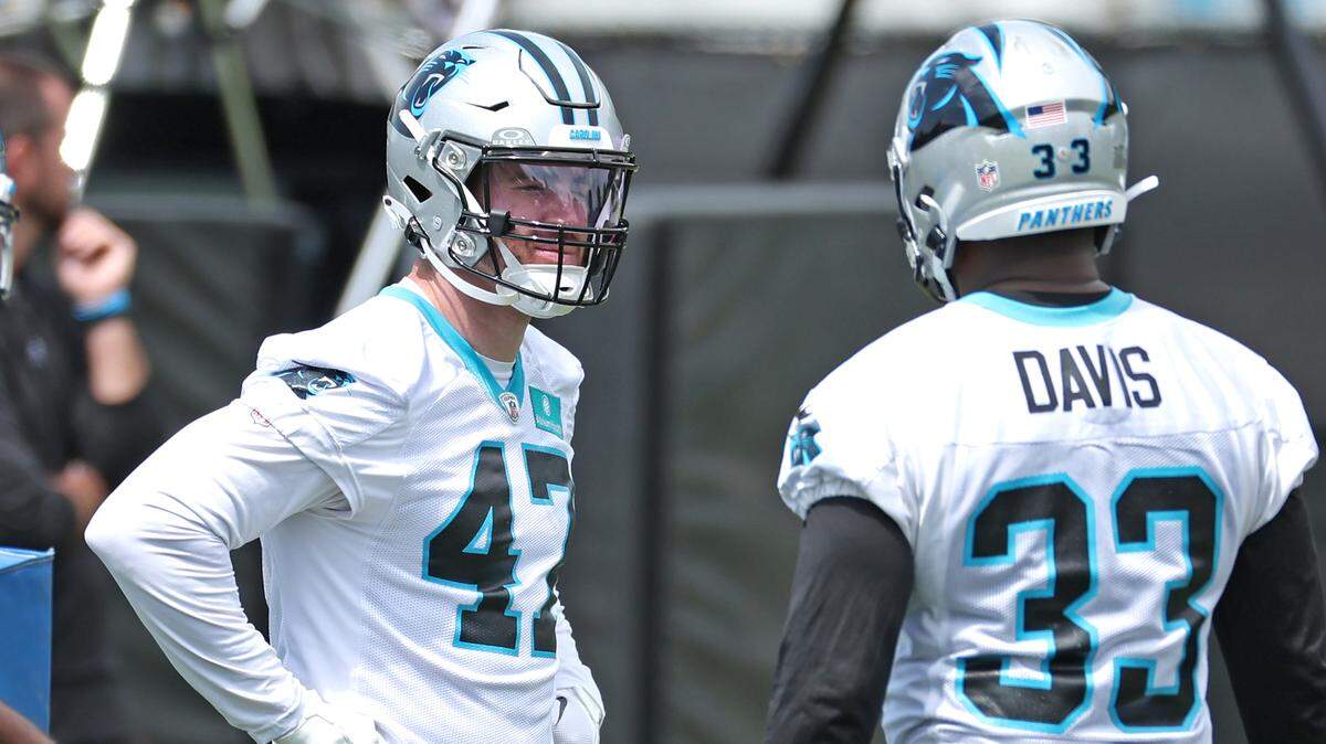 Carolina Panthers linebacker Josey Jewell, center, waits along the sideline for drills to resume at the team’s voluntary minicamp practice on Wednesday, April 24, 2024.