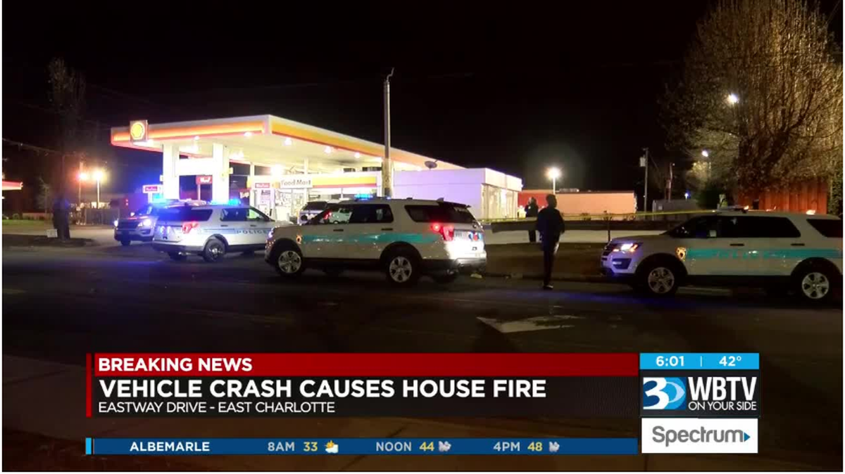 Eastway Drive closed as police investigate stabbing, crash that sparked house fire. WBTV photo