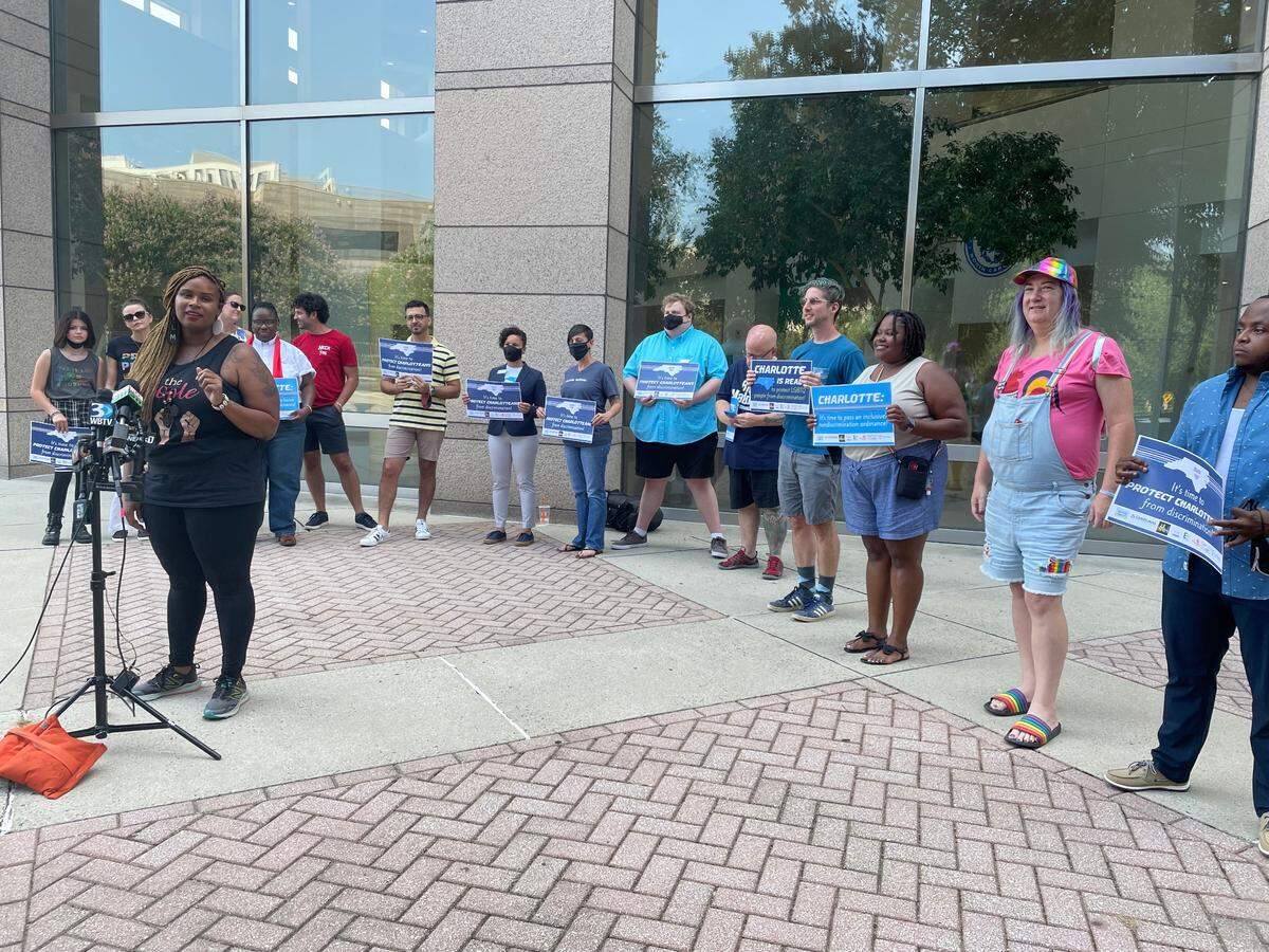 Quin Williams, Charlotte Black Pride’s community outreach director, speaks at the Government Center ahead of the Monday city council meeting about how expanding local nondiscrimination ordinance protections would affect her as a pansexual woman who wears her hair naturally.