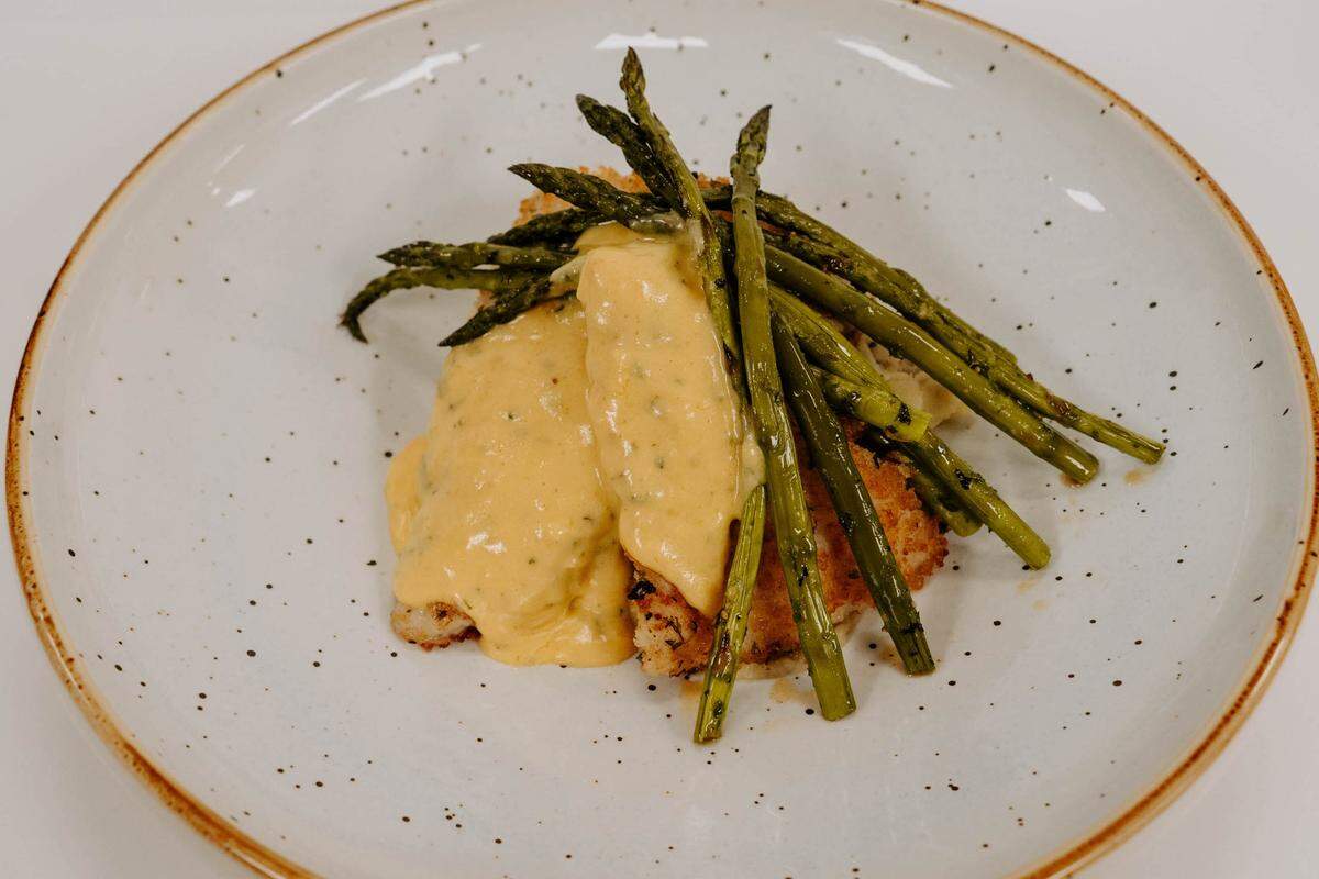Flounder with herb panko crust, garlic mashed potatoes, asparagus and bearnaise sauce at 16 Prime in Denver.