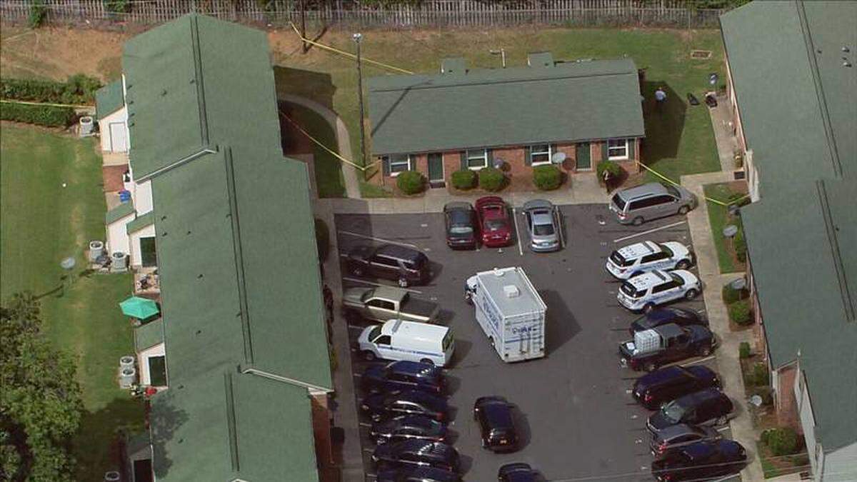 In this image from WSOC’s helicopter, Charlotte-Mecklenburg police investigate the scene of a homicide in the 1400 block of Sharon Road West near South Boulevard on Monday, Aug. 29, 2022.