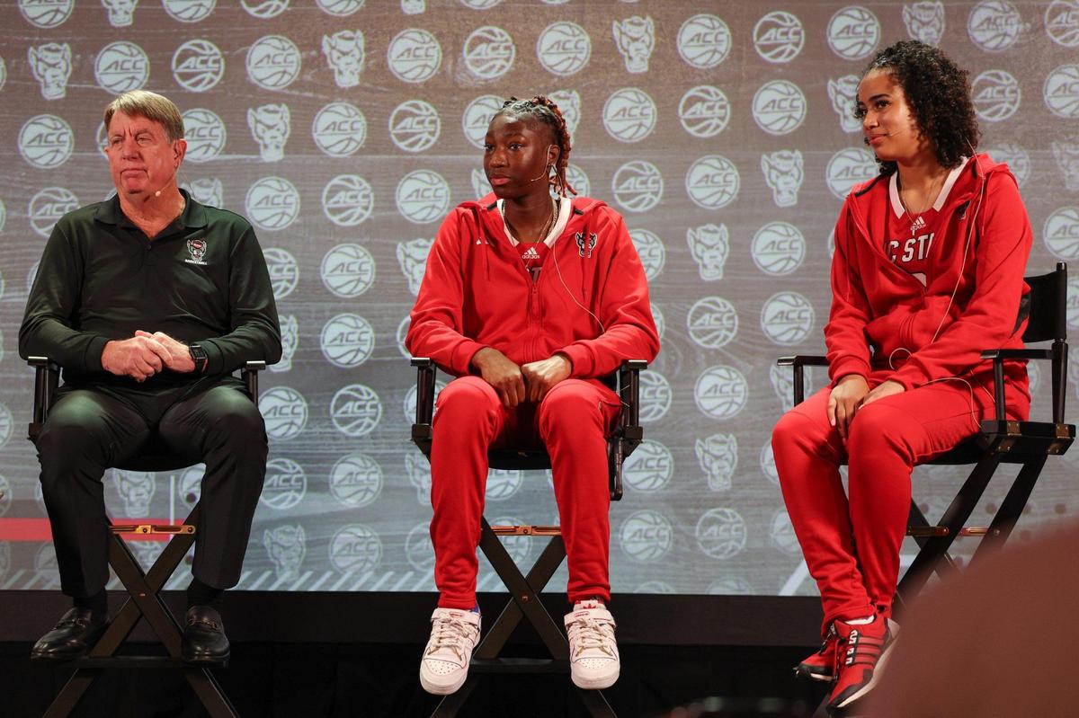 NC State’s women’s head coach Wes Moore, left, and players Saniya Rivers, center, and Madison Hayes speak to media during the ACC Women’s Basketball Tipoff in Charlotte, NC on Tuesday, October 23, 2023.