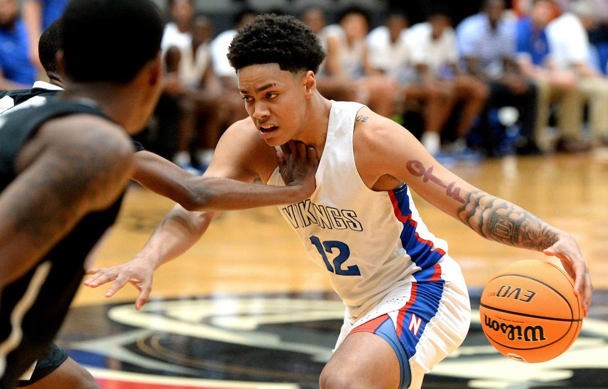 North Mecklenburg’s Tristan Maxwell, driving the ball during his team’s 86-78 win over Olympic Saturday, has signed to play for Georgia Tech next season.