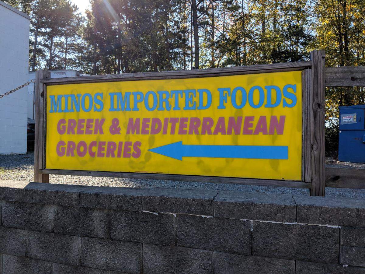 Enter around the back of the building into the warehouse-like Minos Imported Foods, with a large assortment of Greek products available.