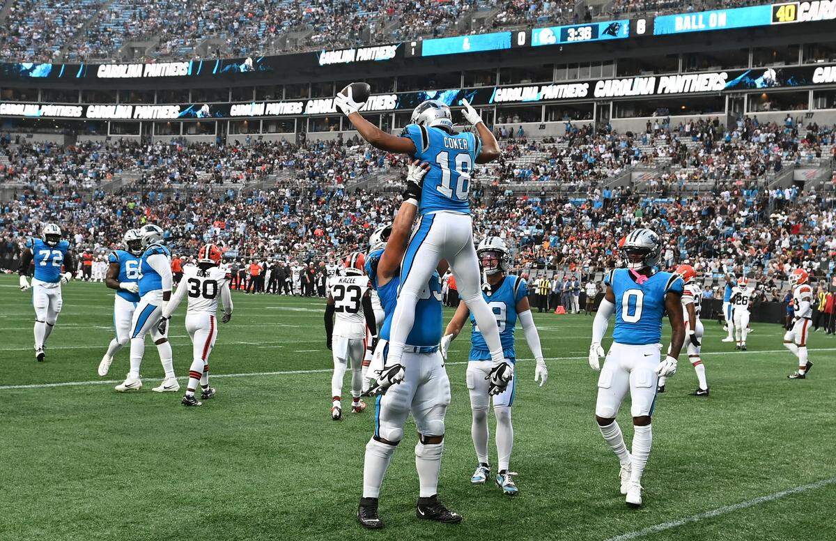 Carolina Panthers wide receiver Jalen Coker is lifted into the air after catching a touchdown pass from quarterback Bryce Young during Friday’s action against the Cleveland Browns at Bank of America Stadium.