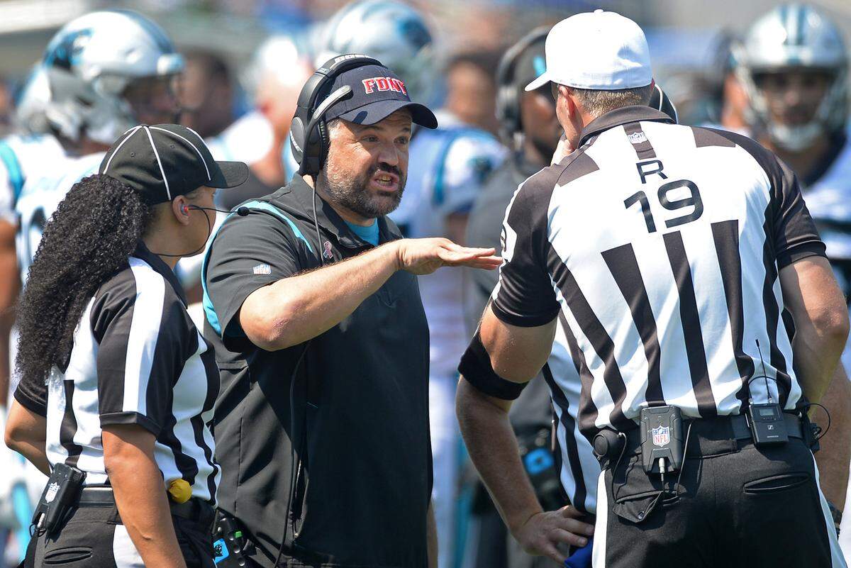 Carolina Panthers head coach Matt Rhule, center, speaks with officials following a play against the New York Jets during second quarter action at Bank of America Stadium in Charlotte, NC on Sunday, September 12, 2021. The Panthers defeated the Jets 19-14.