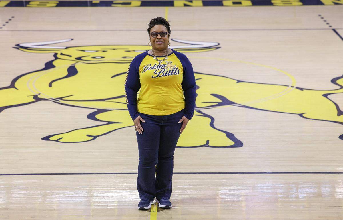 Dr. Denisha Hendricks, Athletic Director and Visiting Associate Professor for Johnson C. Smith University, poses inside Brayboy Gym in Charlotte, NC on Tuesday, January 28, 2025.
