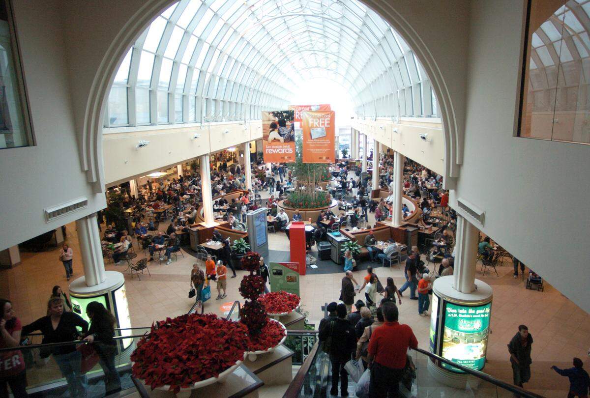 Shoppers walk inside Carolina Place Mall in the file photo.
