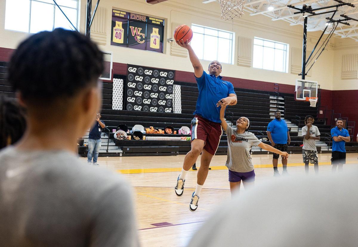 Dallas Mavericks Grant Williams and former Providence Day basketball player plays kids one on one at his basketball camp at West Charlotte High School in Charlotte, N.C., on Friday, July 21, 2023.