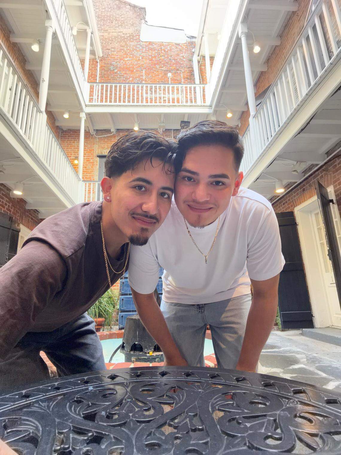 Luis Duque (left) and his boyfriend Oscar, who was detained by ICE during a traffic stop in east Charlotte on Wednesday during their morning work commute.
