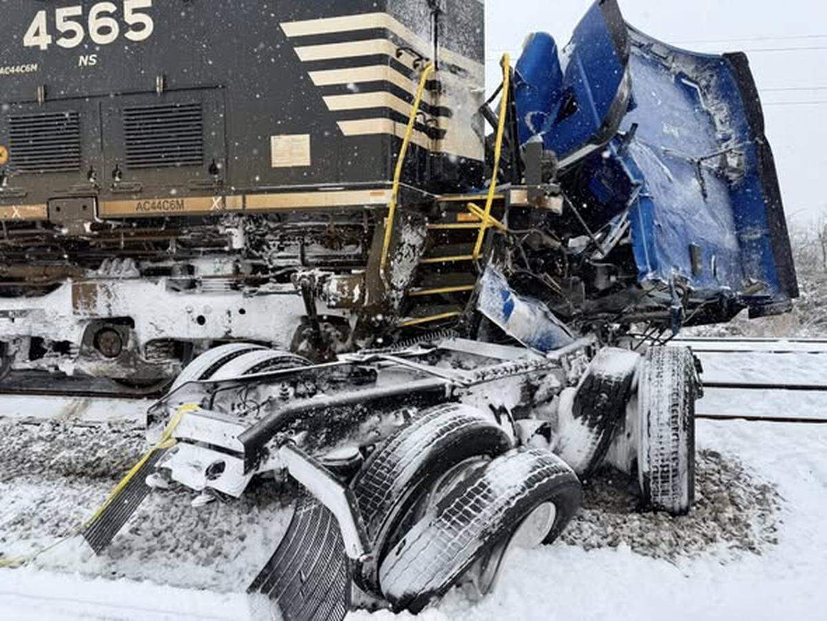 The driver of a semi-tractor trailer escaped injury when a train hit the rig at Poplar Street and Airline Avenue during a snow storm on Saturday, Jan. 31, 2026.