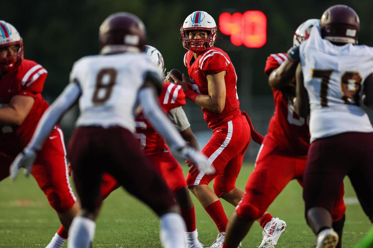 Olympic’s quarterback Elijah Holmes looks for a pass during the game against Harding University High School;on Friday, September 16, 2022 in Charlotte, NC.
