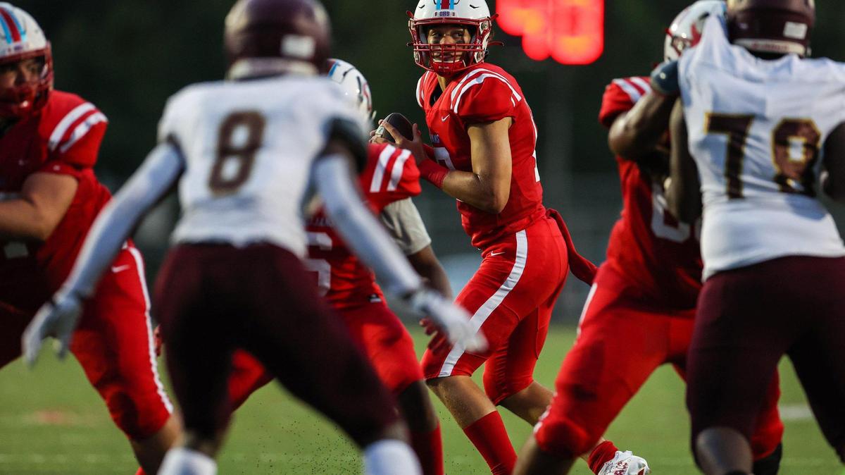 Olympic’s quarterback Elijah Holmes looks for a pass during the game against Harding University High School;on Friday, September 16, 2022 in Charlotte, NC.