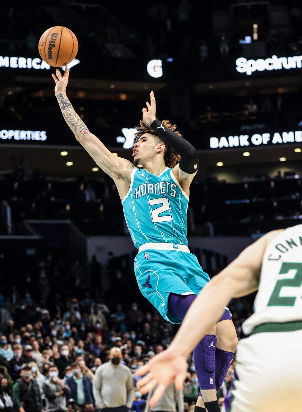 Charlotte Hornets guard LaMelo Ball shoots a floater in the lane for the game-winning basket against the Milwaukee Bucks at the Spectrum Center in Charlotte, N.C., on Monday, January 10, 2022. Charlotte won, 103-99. It was Ball’s first game-winning hoop in the final minute of an NBA game.