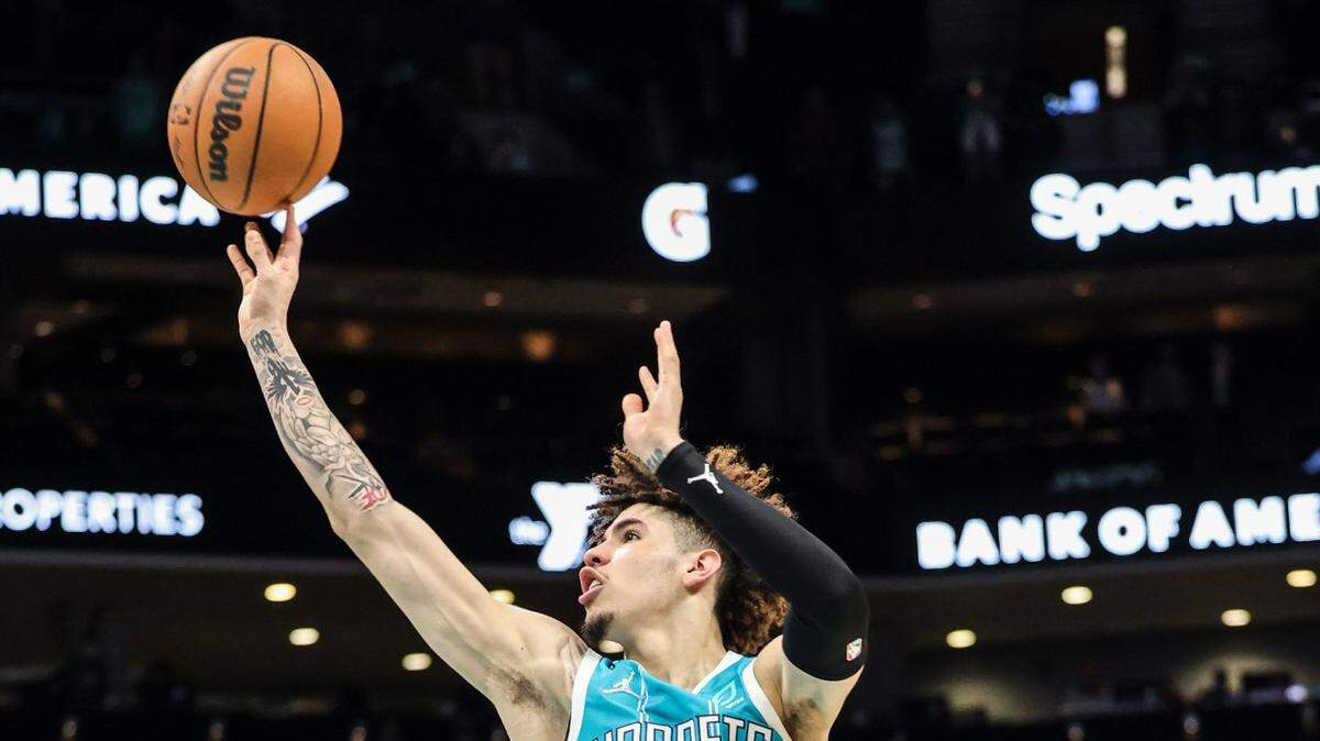 Hornets guard LaMelo Ball shoots a floater in the lane for the winning basket against the Milwaukee Bucks at Spectrum Center in Charlotte, N.C., on Monday, January 10, 2022. Charlotte won, 103-99. It was Ball’s first game-winning hoop in the final minute of an NBA game.
