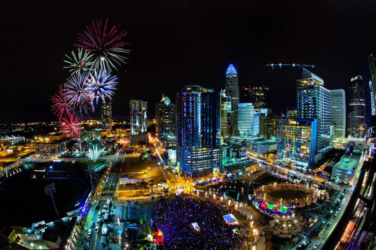 Fireworks explode against the backdrop of the Charlotte skyline, as thousands of people gathered at Romare Bearden Park on New Year’s Eve to ring in 2017. The uptown event returns on Dec. 31, 2021.